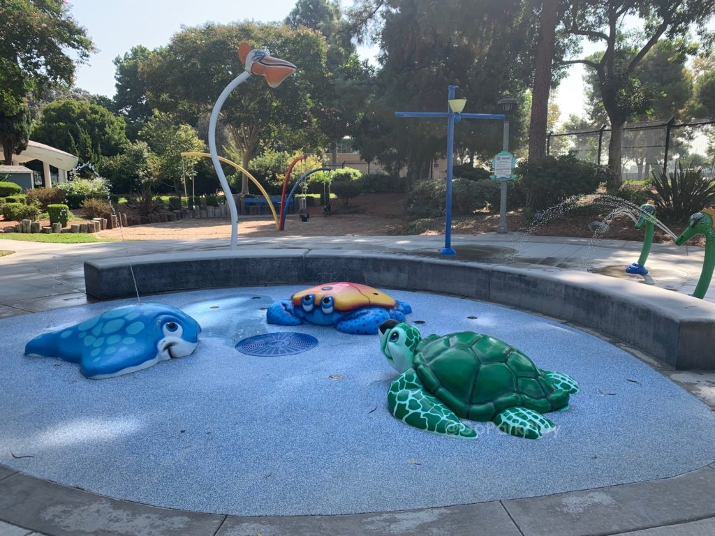 Atlantis Playcenter Splash Pad with crab, sea turtle, sting ray and spraying rings in Garden Grove CA