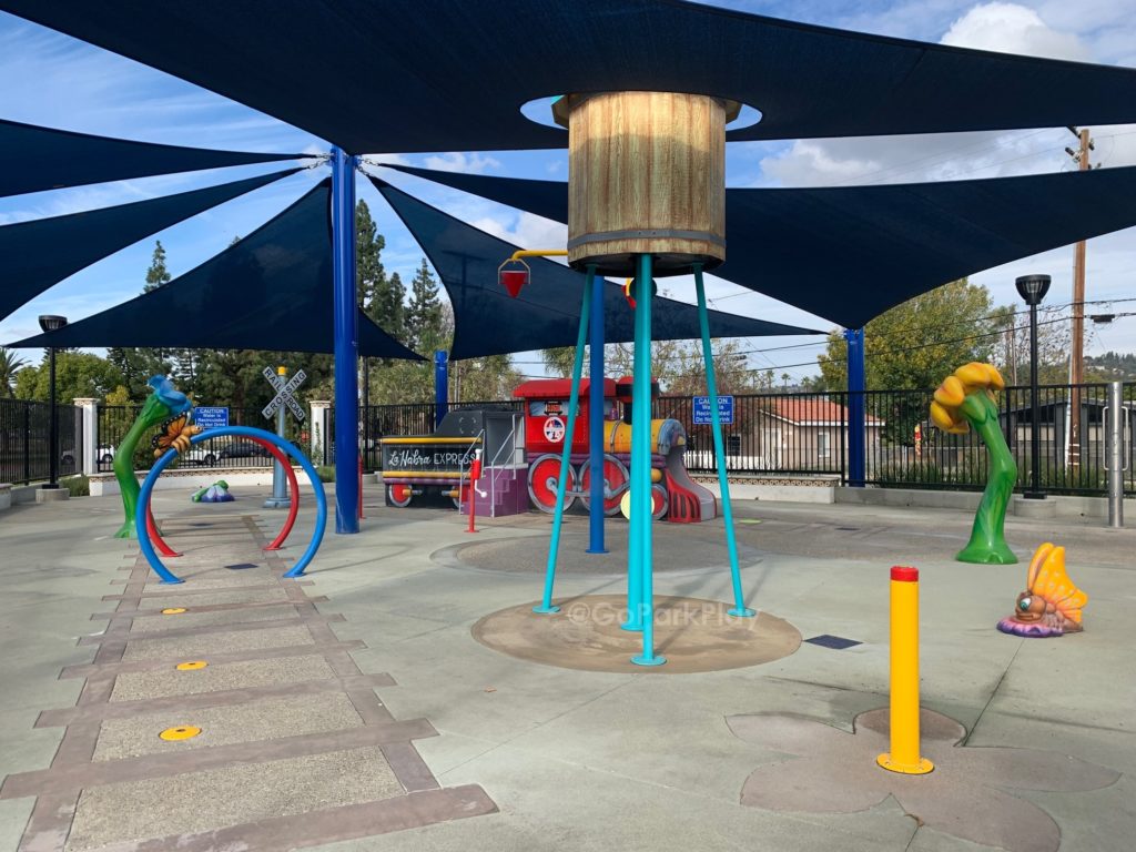 Brio Park Splash Pad with train and spraying rings and dumping bucket in La Habra CA