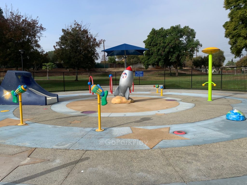 Oeste Park Splash Pad with rocket ship, slide and spraying water in La Habra CA