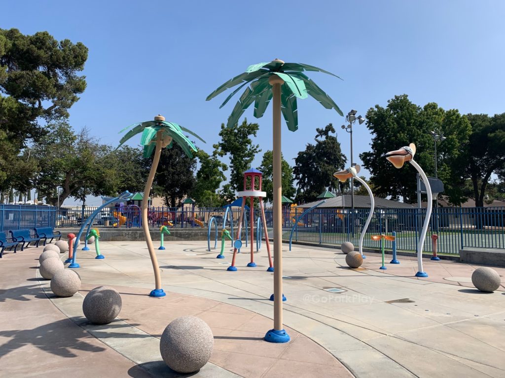 Sigler park splash pad with palm trees and sprayers in Westminster CA